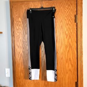 Pink leggings,  black with white and gray and laces along the ankle. Size medium